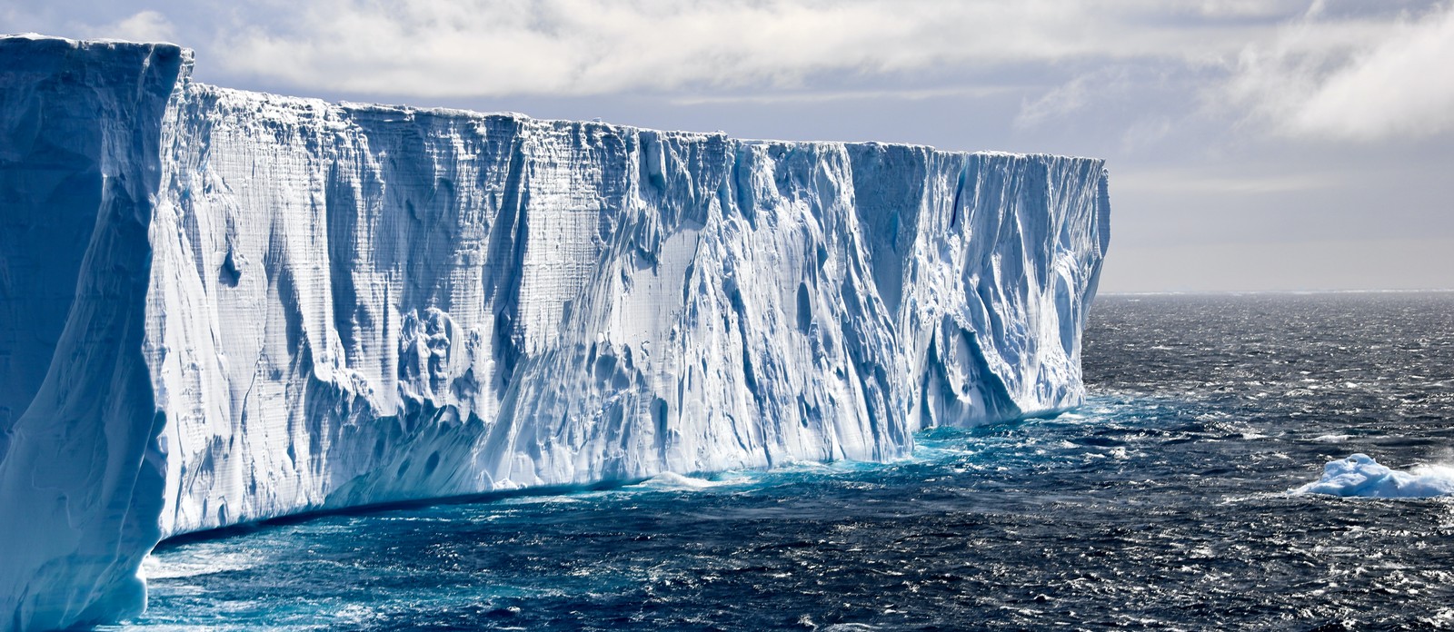 About what percentage of the world's ice is located in Antarctica?