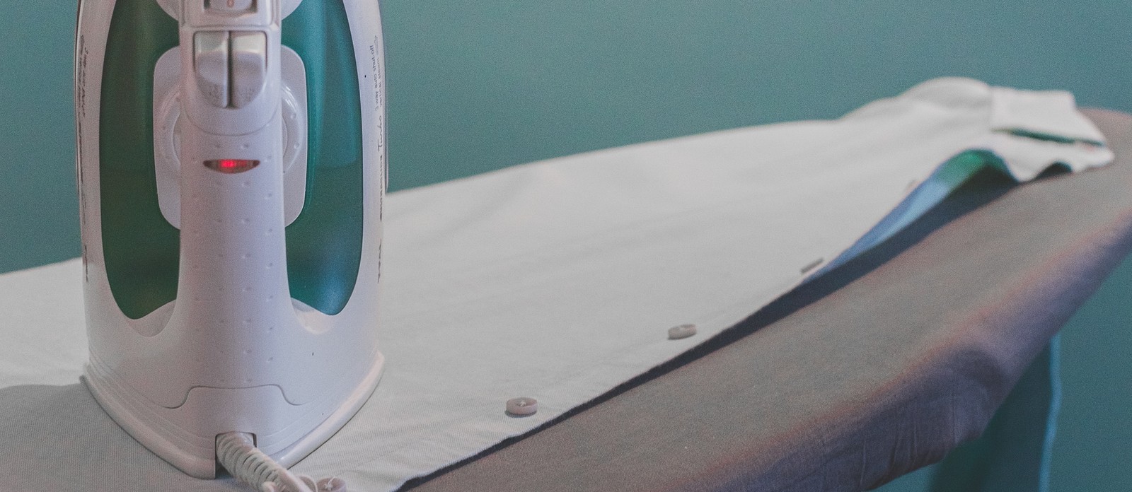 When was the first electric iron invented?