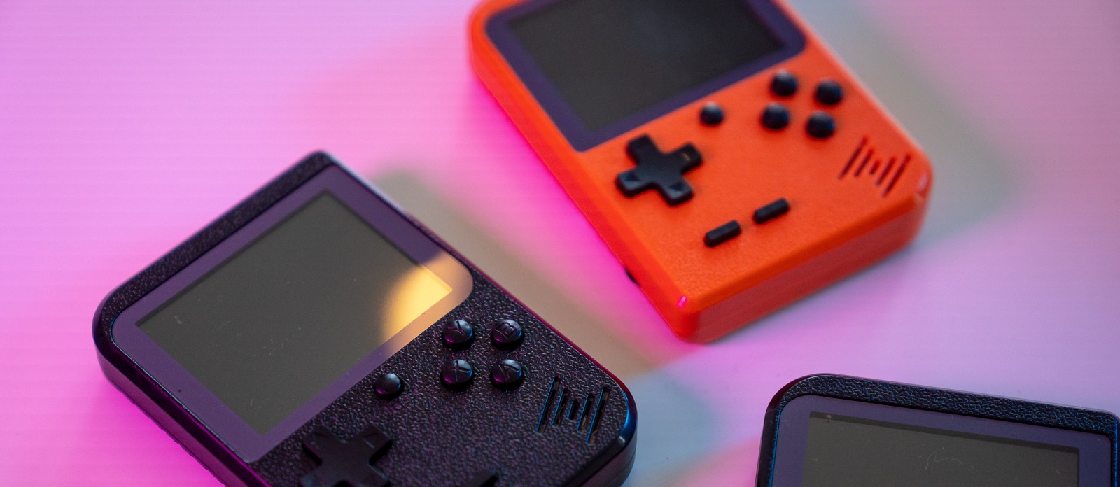 Who introduced the first handheld electronic game in 1976?