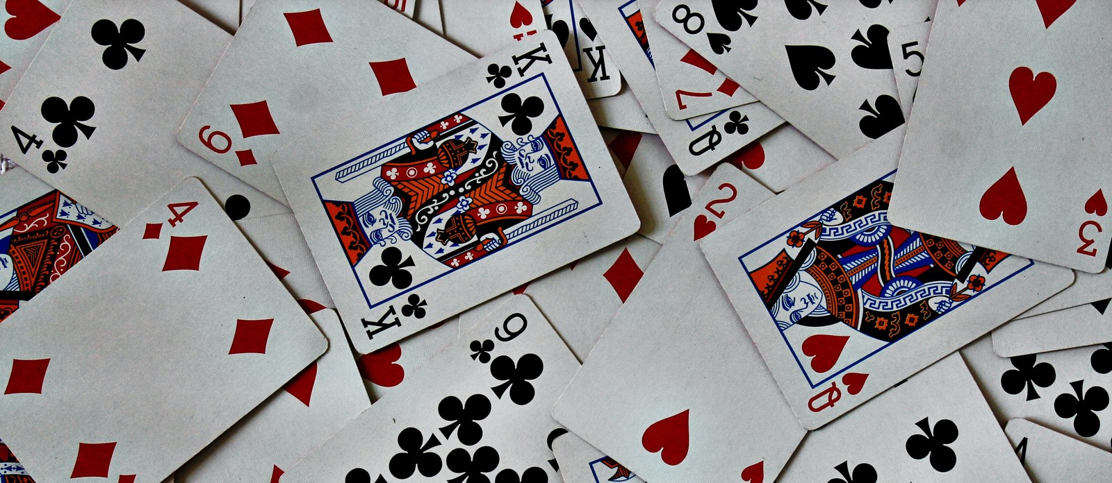 Which traditional card game involves making cards add up to 21?
